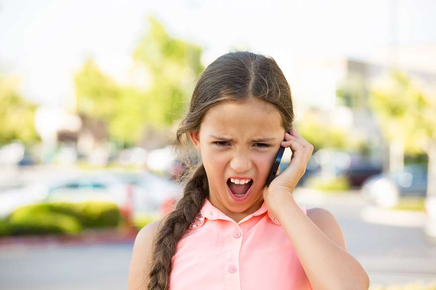 picture of an angry child with cell phone